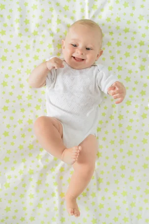 Клеенка подкладная с ПВХ-покрытием ROXY-KIDS 68х100 см, цвет фисташковые звезды